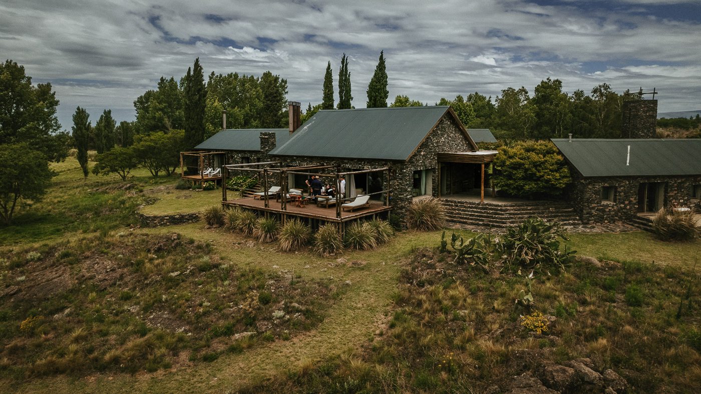 The stone house, the deck and the cypresses