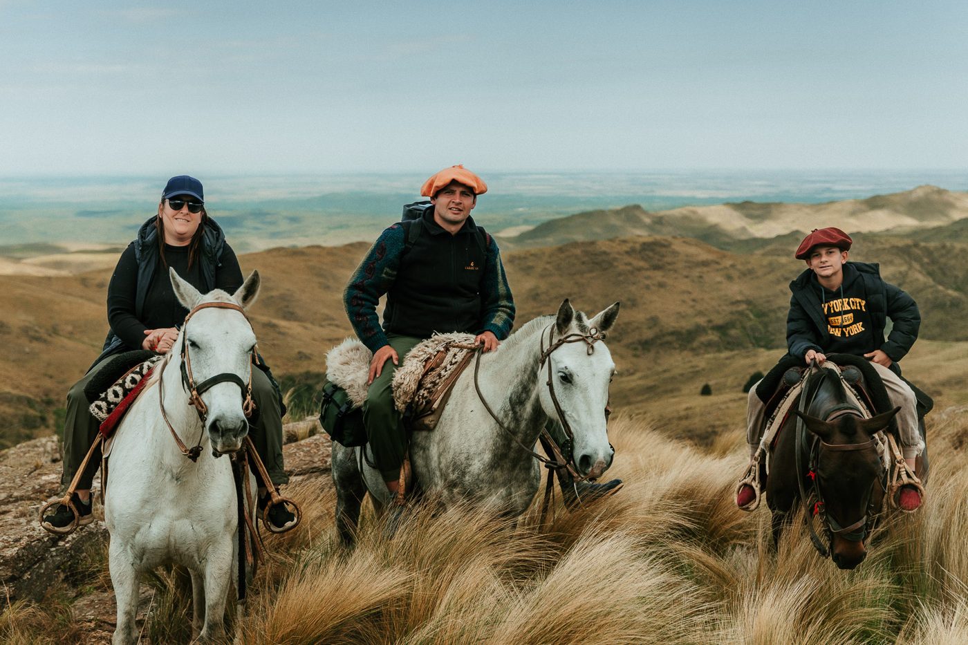 Three riders in the grassland, ready to go