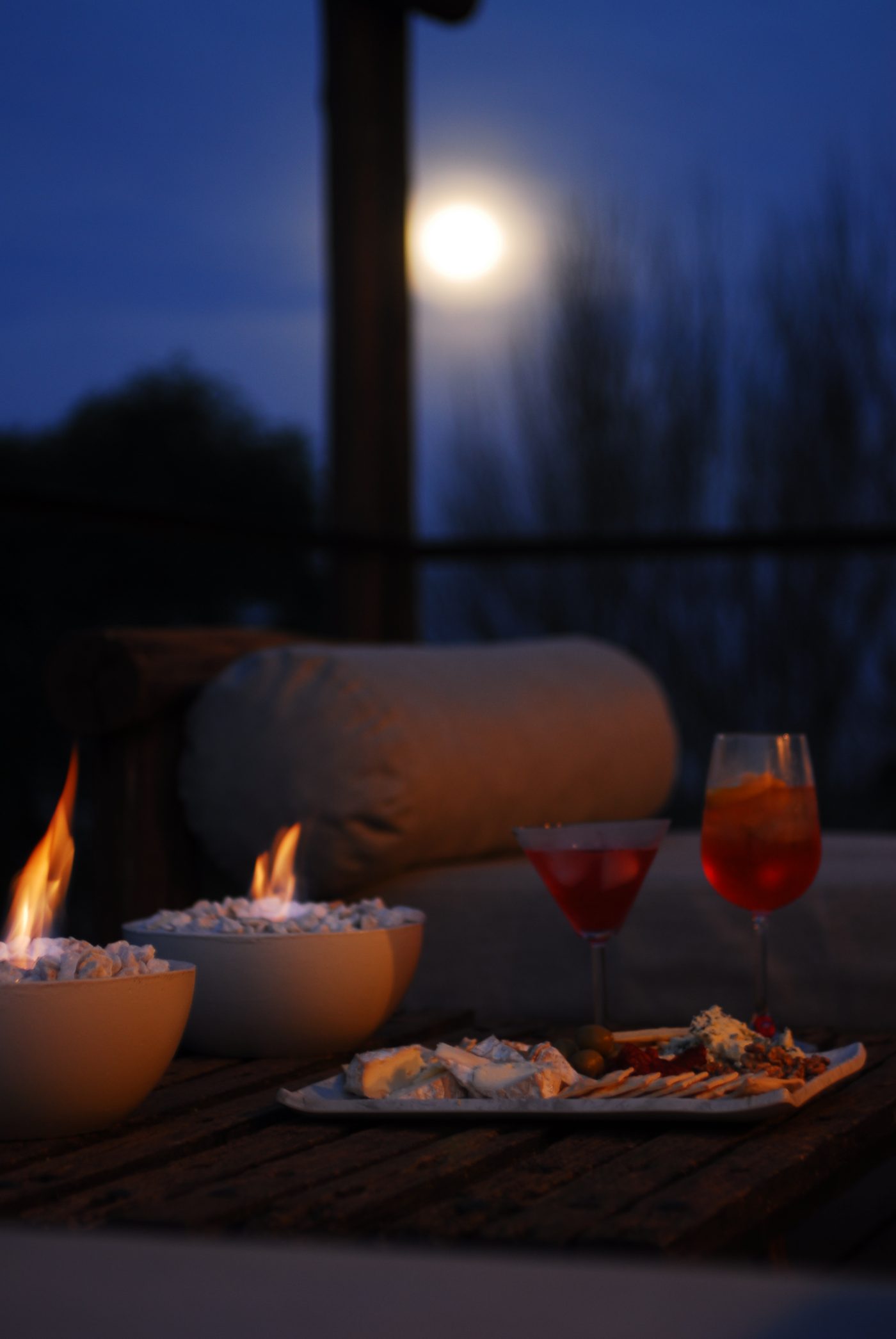 Two drinks on the deck as the moon rises