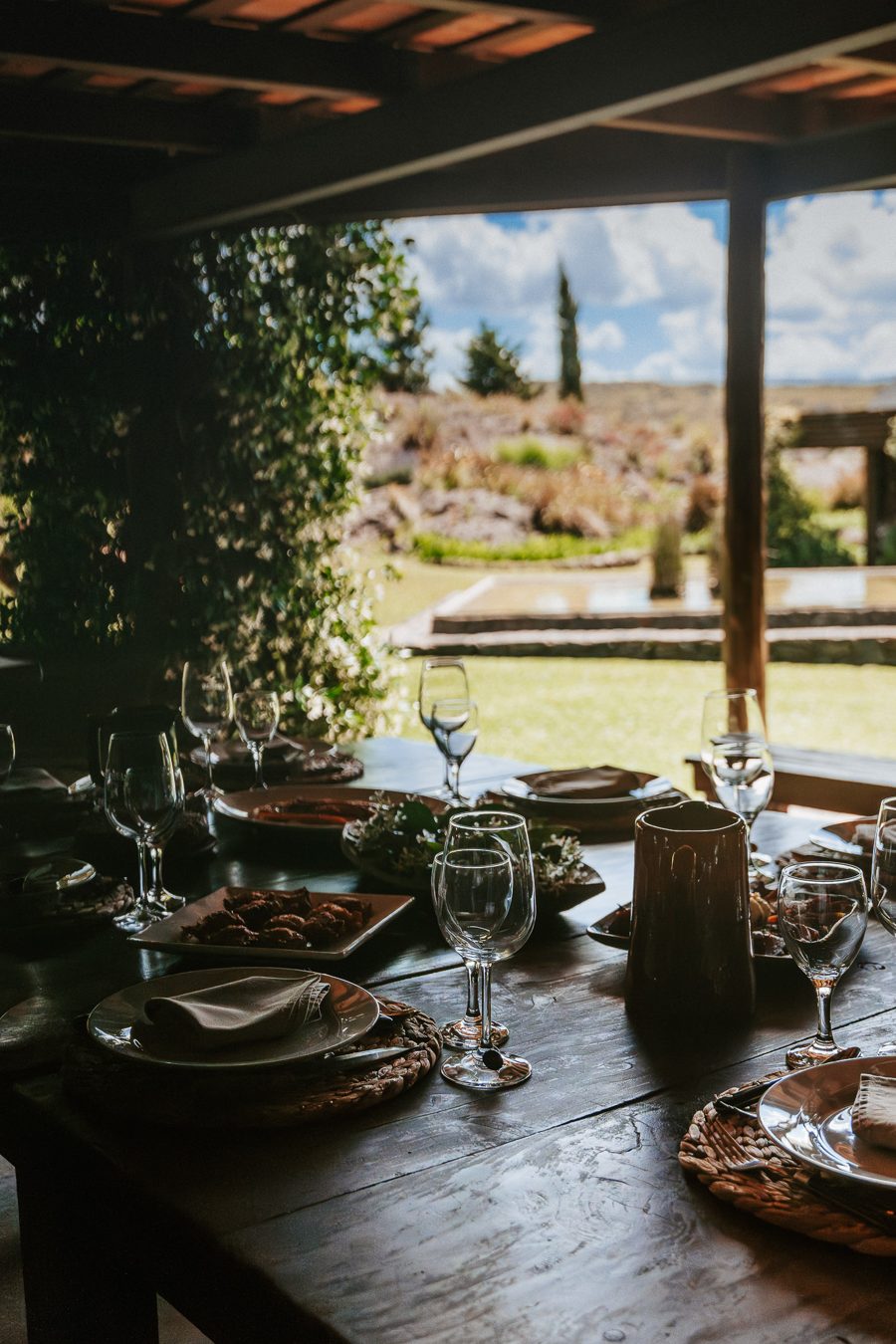 The table set in the gallery, the garden behind