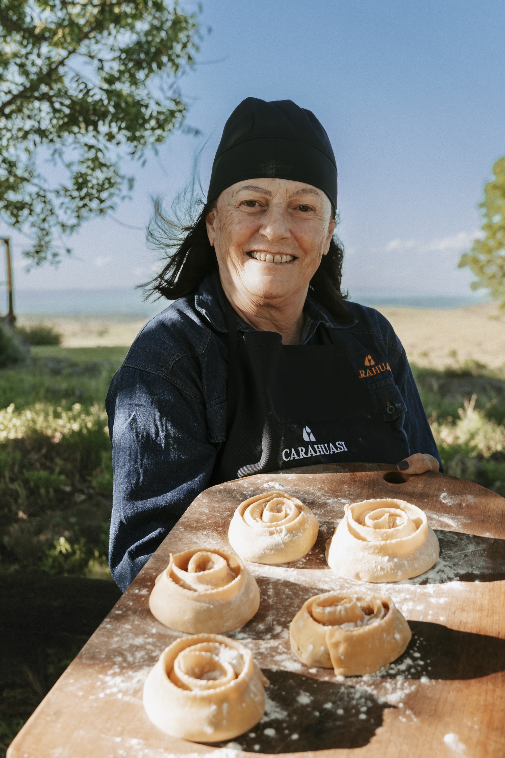 Luciana with a tray of freshly made rolls