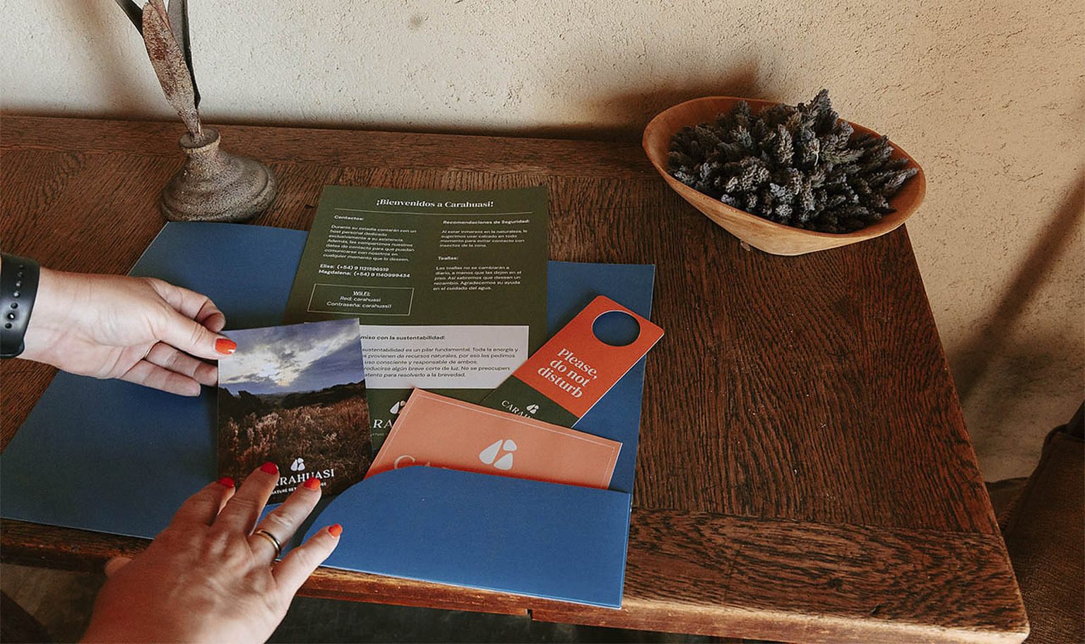 The Carahuasi welcome kit laid out on a wooden desk